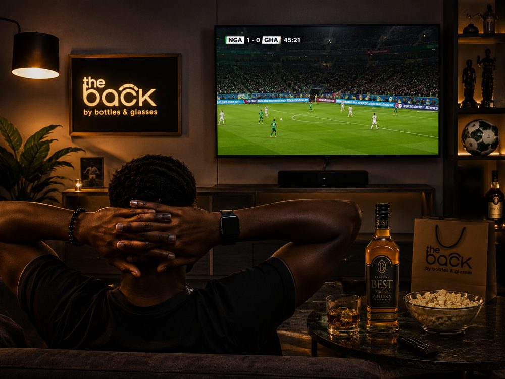 Watching a Premier League matchday at The Back, with a bottle of Best Whiskey